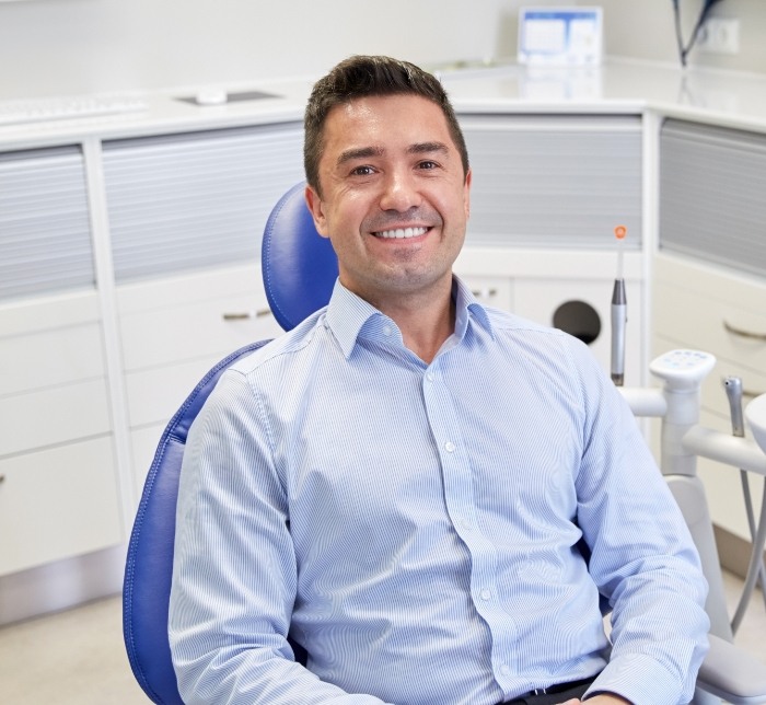 Man smiling after gum disease treatment